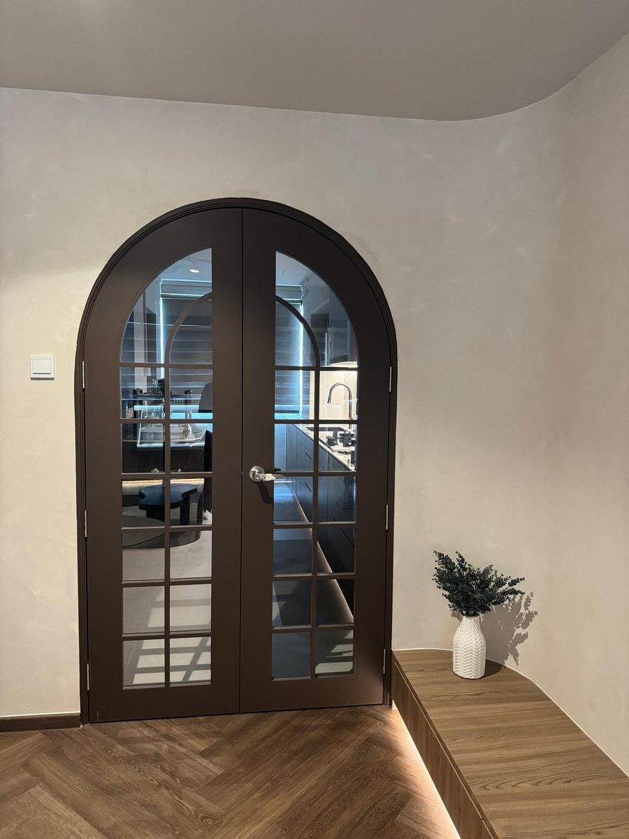 Arched black-framed french doors, installed by Door Empire Singapore