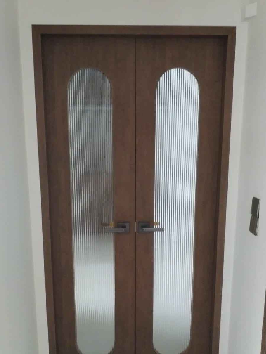 Arched double doors with fluted glass, installed by Door Empire Singapore