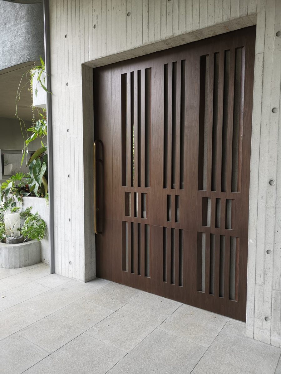 Slatted timber sliding doors, installed by Door Empire Singapore