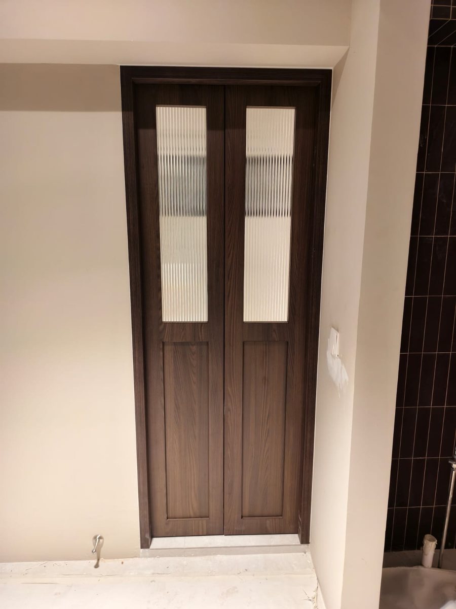Dark timber door with glass inlay, installed by Door Empire Singapore