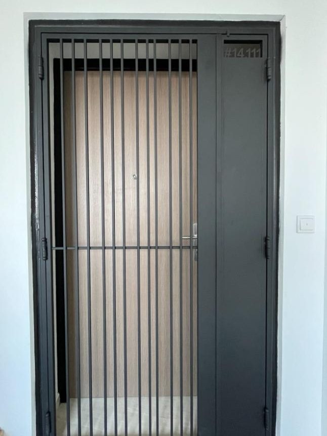 Dark vertical-bar privacy gate, installed by Door Empire Singapore