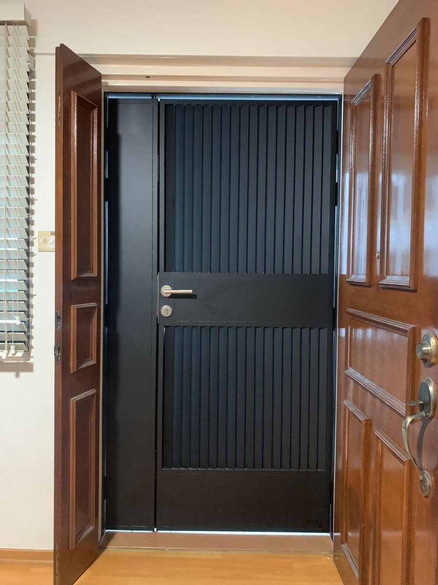 Black gate with timber main door, installed by Door Empire Singapore
