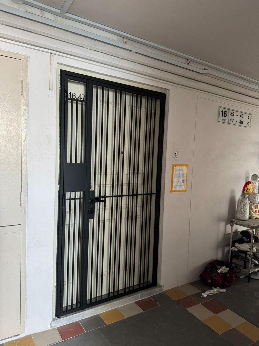 Black gate on marble entrance, installed by Door Empire Singapore