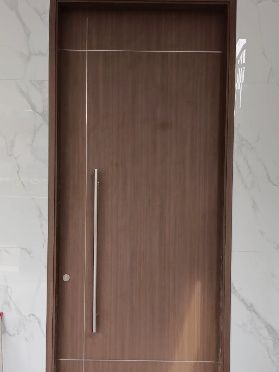 Walnut laminate main door on marble, installed by Door Empire Singapore