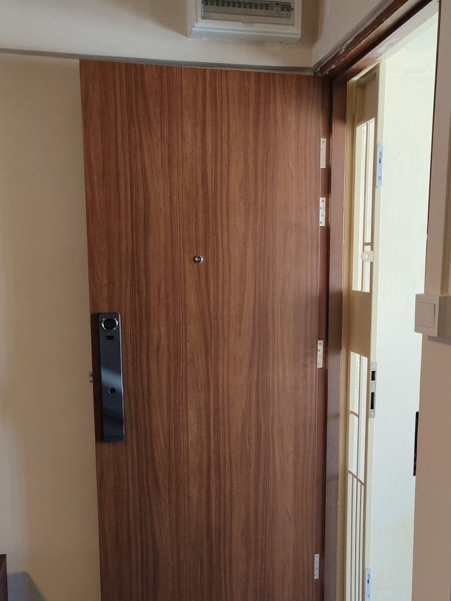 Walnut main door with digital lock, installed by Door Empire Singapore