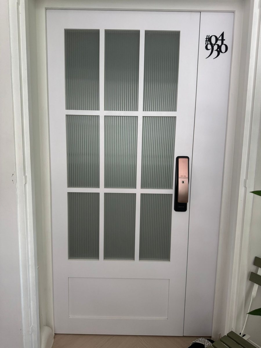Classic white main door with glass panes, installed by Door Empire Singapore