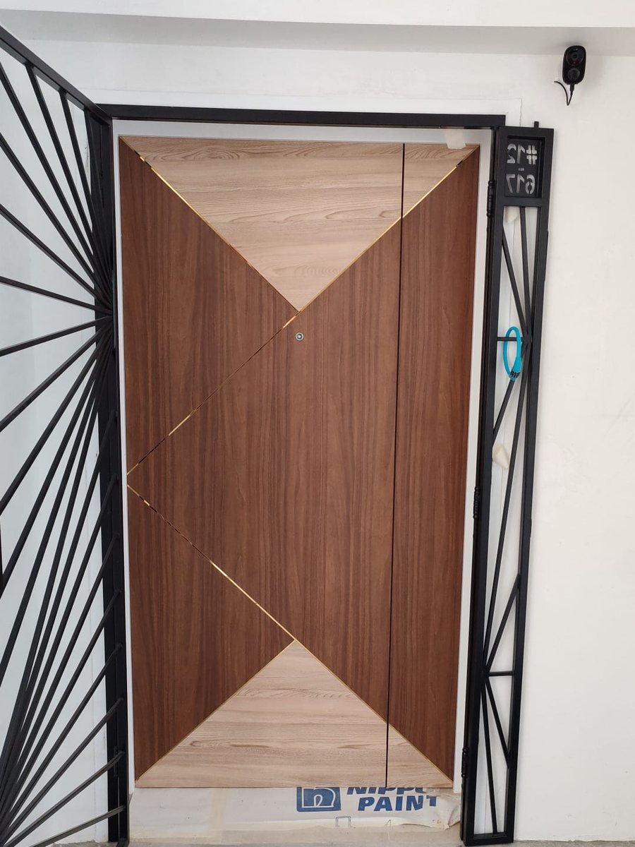 Chevron timber door with designer gate, installed by Door Empire Singapore